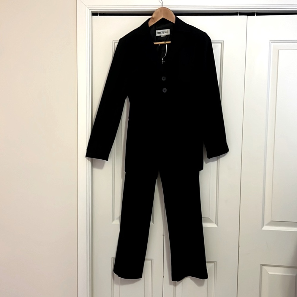 Black women's suit. Two button jacket and pants with black pinstripe